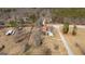 Aerial view of the roof, yard, and the surrounding area showcasing community at 5700 Mount Zion Rd, Waco, GA 30182