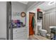 Renovated bathroom with a sink, toilet, updated shower, and tile floor at 5700 Mount Zion Rd, Waco, GA 30182