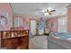Cozy bedroom with neutral walls, ceiling fan, and multiple windows providing natural light at 5700 Mount Zion Rd, Waco, GA 30182