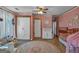 Spacious bedroom features a crib, multiple windows, and a decorative rug at 5700 Mount Zion Rd, Waco, GA 30182