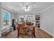 Bright dining area with hardwood floors connects to the kitchen with built-in shelves at 5700 Mount Zion Rd, Waco, GA 30182