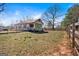 Charming country home with red shutters, a metal roof, and a fenced yard at 5700 Mount Zion Rd, Waco, GA 30182