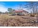 Charming single story home with a red metal roof and fenced yard at 5700 Mount Zion Rd, Waco, GA 30182