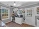 Modern kitchen with white cabinetry, stainless steel appliances, and natural light at 5700 Mount Zion Rd, Waco, GA 30182