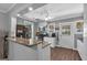 Stylish kitchen boasting granite countertops, white cabinets, and stainless steel appliances at 5700 Mount Zion Rd, Waco, GA 30182