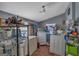 Functional laundry room with washer, dryer, storage shelving, and natural light for efficient home management at 5700 Mount Zion Rd, Waco, GA 30182