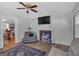 Comfortable living room with hardwood floors, fireplace, and a view into the dining room, great for Gathering gatherings at 5700 Mount Zion Rd, Waco, GA 30182