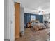 Large main bedroom boasts a statement wall, ceiling fan, and natural light at 5700 Mount Zion Rd, Waco, GA 30182