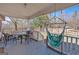 Relaxing front porch featuring comfortable seating and a hanging hammock at 5700 Mount Zion Rd, Waco, GA 30182