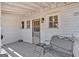 Relaxing porch with seating, providing a charming outdoor space to enjoy the fresh air and peaceful surroundings at 5700 Mount Zion Rd, Waco, GA 30182