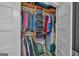 Organized walk-in closet with ample hanging space, shelves, and storage baskets for efficient organization at 5700 Mount Zion Rd, Waco, GA 30182