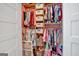 Well-organized walk-in closet with hanging racks, shelves, and storage bins for maximizing space and tidiness at 5700 Mount Zion Rd, Waco, GA 30182