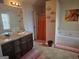 A bathroom featuring a double vanity with granite countertop, tub, and shower at 620 Calvo Run, Mcdonough, GA 30253