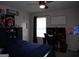 Bedroom featuring a dark blue bed, desk, and posters at 620 Calvo Run, Mcdonough, GA 30253