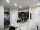 Modern kitchen with stainless steel appliances and island at 620 Calvo Run, Mcdonough, GA 30253