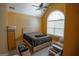 Cozy bedroom featuring carpet flooring, ceiling fan, and a large window with lots of natural light at 424 Norman Ct, Hampton, GA 30228