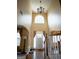 Elegant foyer with high ceilings, chandelier, and staircase at 424 Norman Ct, Hampton, GA 30228