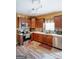 Modern kitchen with stainless steel appliances, wooden cabinets, and updated countertops at 424 Norman Ct, Hampton, GA 30228