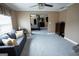 Inviting living room with a comfortable sofa and a view into the main bedroom at 424 Norman Ct, Hampton, GA 30228