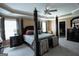 Spacious main bedroom with tray ceiling, large bed, and a walk-in closet at 424 Norman Ct, Hampton, GA 30228