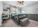 Bedroom with neutral walls, plush carpet, a ceiling fan and desk at 407 Holly Grove Church Rd, Peachtree City, GA 30269