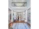 Grand foyer featuring soaring ceilings, hardwood floors, a second-story overlook, and an elegant rug at 407 Holly Grove Church Rd, Peachtree City, GA 30269