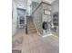 Foyer with tile flooring, staircase, and view of pantry with shelving space at 407 Holly Grove Church Rd, Peachtree City, GA 30269
