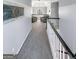 Hallway with plush carpet and an open area with seating in front of a window at 407 Holly Grove Church Rd, Peachtree City, GA 30269