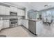 Bright kitchen featuring white cabinets, stainless steel appliances, and a stylish backsplash at 407 Holly Grove Church Rd, Peachtree City, GA 30269
