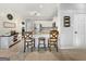 Charming kitchen with white cabinetry, stainless steel appliances, and a breakfast bar with seating at 407 Holly Grove Church Rd, Peachtree City, GA 30269