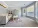 Cozy living room with neutral walls, bright windows, a comfortable couch, and stylish decor at 407 Holly Grove Church Rd, Peachtree City, GA 30269