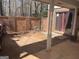 Covered back patio with brick wall and outdoor access, providing a private retreat at 79 Flint River Rd, Riverdale, GA 30274