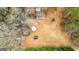 Aerial view of the property showing the house, outbuildings, and surrounding landscape at 1115 Highway 54 East, Fayetteville, GA 30214