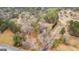 Aerial view of the property showing the road, driveway, and surrounding trees at 1115 Highway 54 East, Fayetteville, GA 30214