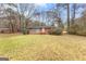 Charming brick home with a well-maintained front yard and mature trees at 1115 Highway 54 East, Fayetteville, GA 30214