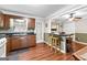 Open kitchen with a breakfast bar, stylish cabinets, and views to the dining area at 1115 Highway 54 East, Fayetteville, GA 30214