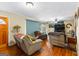 Bright living room offers comfortable seating, natural light, and an open doorway at 1115 Highway 54 East, Fayetteville, GA 30214