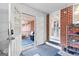 Mudroom with doors to screened porch, backyard and shelving to store shoes at 1115 Highway 54 East, Fayetteville, GA 30214