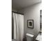 Bathroom featuring a shower with a white curtain, granite countertop, and a white toilet at 247 Ivey Ter # 45, Temple, GA 30179