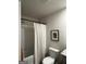 Bathroom with a white shower curtain, tub, toilet, and wall art at 109 Meadowview Dr # 22, Temple, GA 30179