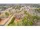 Aerial view of wooded property with buildings at 1119 Highway 54 East, Fayetteville, GA 30214
