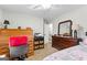 This bright bedroom features a ceiling fan, natural lighting, and decorative furnishings at 1119 Highway 54 East, Fayetteville, GA 30214