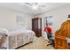 This comfortable bedroom features a plush quilt, bright natural lighting, and an organized desk space at 1119 Highway 54 East, Fayetteville, GA 30214