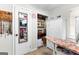 This walk in closet features custom storage solutions, full length mirror and overhead lighting at 1119 Highway 54 East, Fayetteville, GA 30214