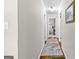 Inviting hallway with hardwood floors, neutral paint, and plenty of natural light at 1119 Highway 54 East, Fayetteville, GA 30214