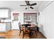 Kitchen area features a wooden dining table with 4 chairs and view to screened-in porch at 1119 Highway 54 East, Fayetteville, GA 30214