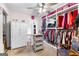 This walk-in closet boasts ample storage, including shelving, hanging racks, and an ironing station at 1119 Highway 54 East, Fayetteville, GA 30214