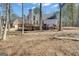 Expansive backyard with a deck and plenty of trees, providing a serene outdoor space at 407 Blue Smoke Trl, Peachtree City, GA 30269
