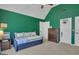 Green bedroom featuring a daybed, wood dresser and a closet offering ample space at 407 Blue Smoke Trl, Peachtree City, GA 30269