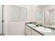 Bathroom featuring a double sink vanity, gray countertops, and decorative wall art at 362 Friendship Oak Way, Hampton, GA 30228